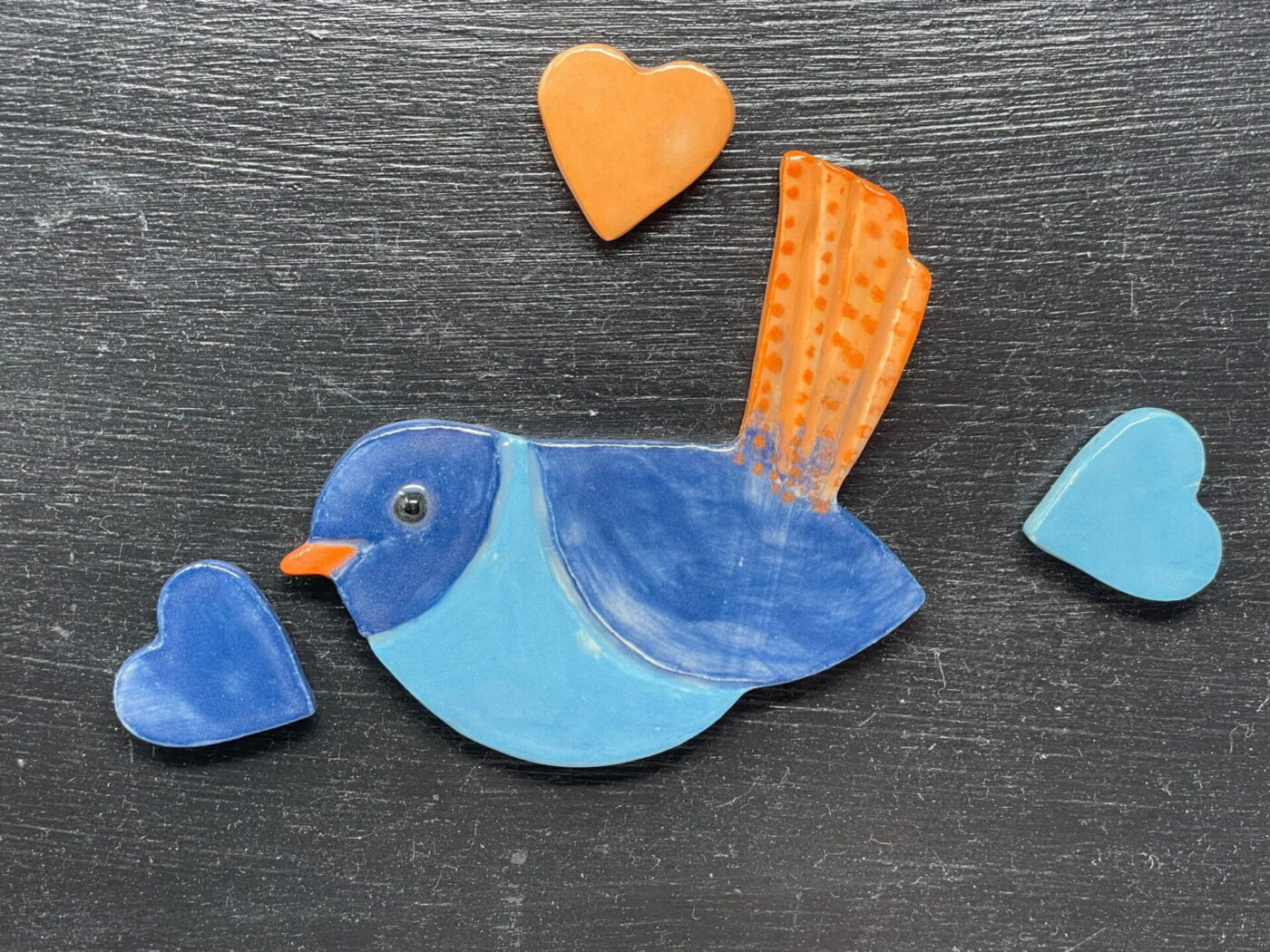 Bird & Three Hearts Ceramic Magnet Set — in use