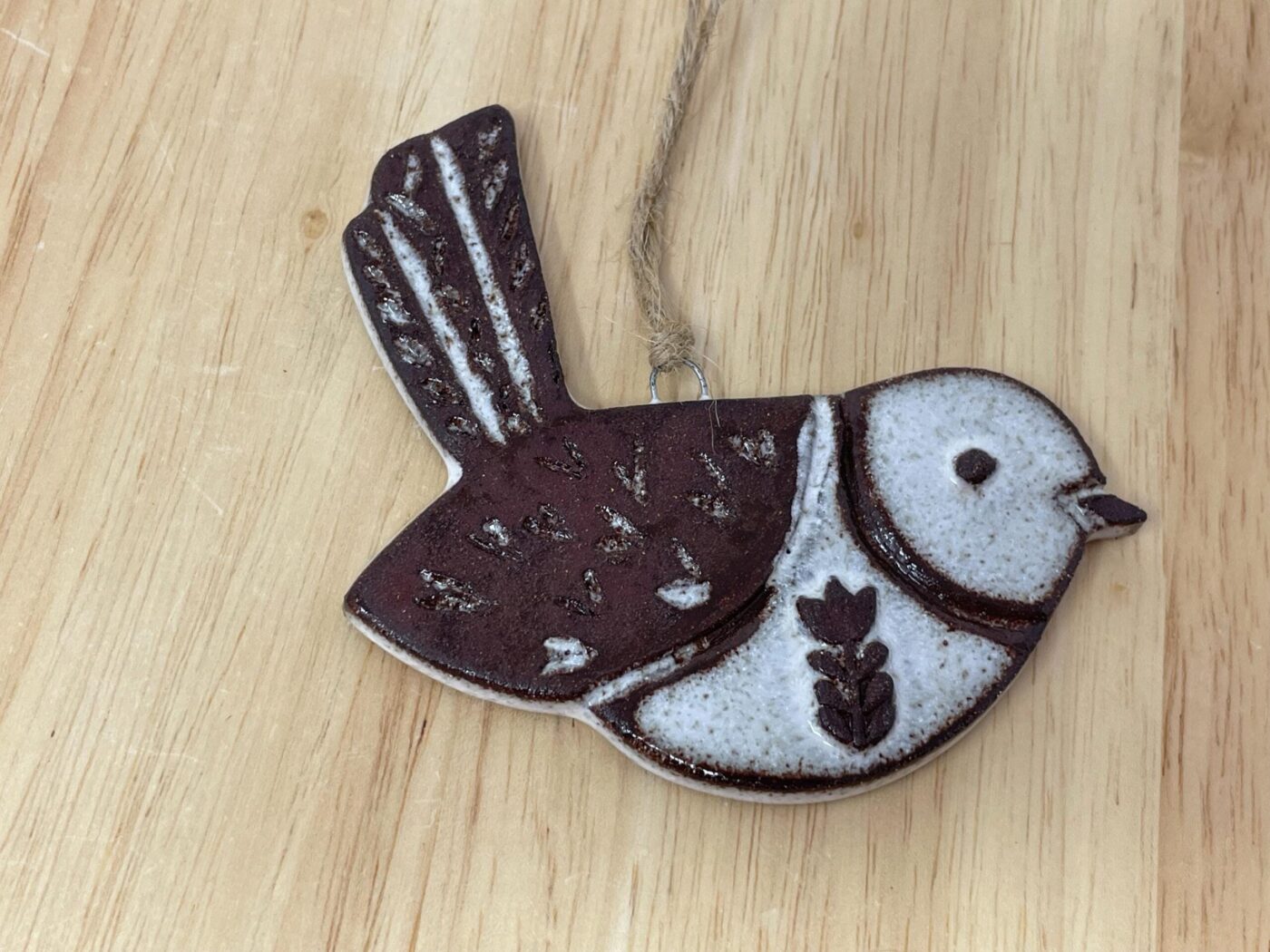 Hanging Ceramic Bird — Terracotta & White Glaze (Hearts) — in use