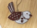Hanging Ceramic Bird — Terracotta & White Glaze (Hearts) — styling detail