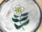 Sgraffito Flower Terracotta Plate — Green & Blue — in use